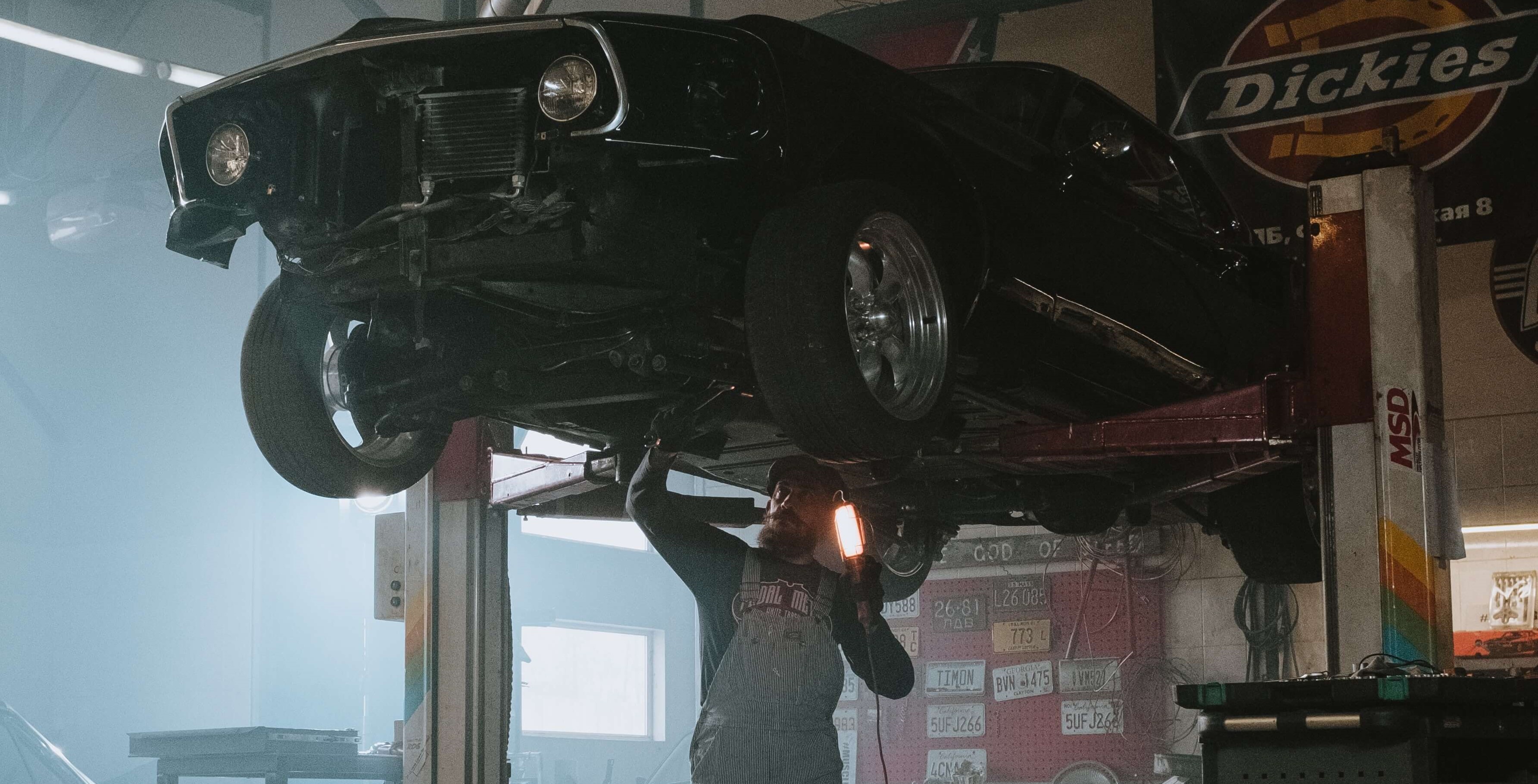 Man repairing a car.